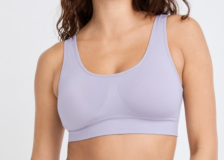 Light purple sports bra worn by a person on a plain background