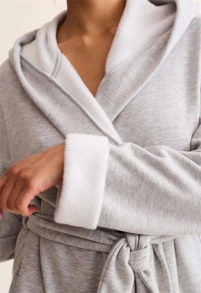 Gray robe with white trim worn by a person