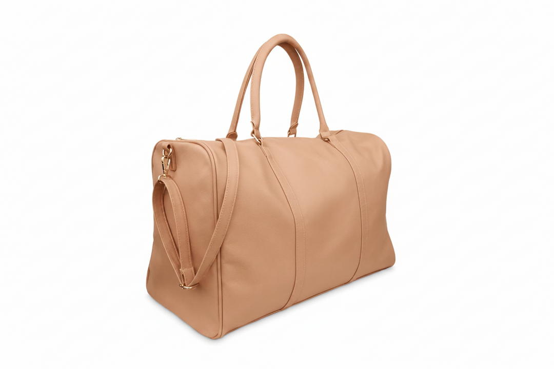 A tan leather duffel bag with double top handles, a detachable shoulder strap, 