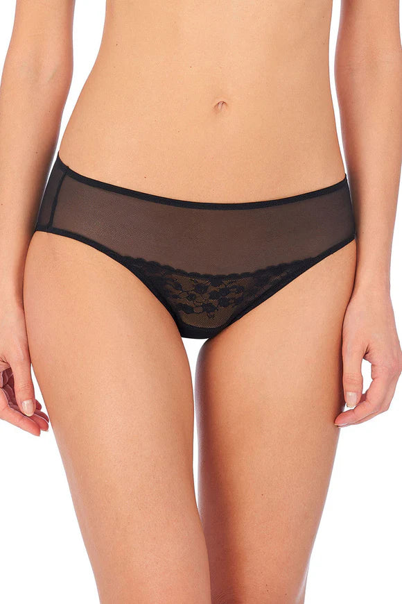 Black lace underwear worn by a person on a white background