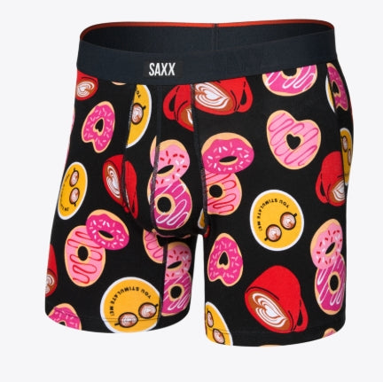 Black boxer briefs with colorful donut pattern on a white background