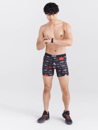 Man wearing black patterned underwear on a white background