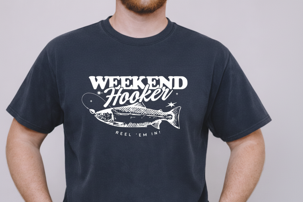 Person wearing a Navy t-shirt with 'Weekend Hooker' graphic design