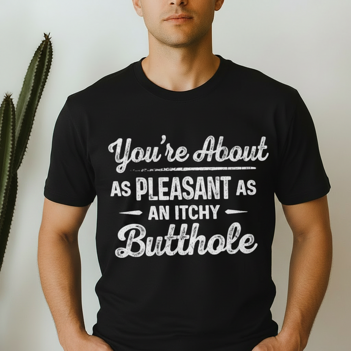 A Man wearing a Black tshirt with a black printed graphic that reads 'You're About AS PLEASANT AS AN ITCHY Butthole'.